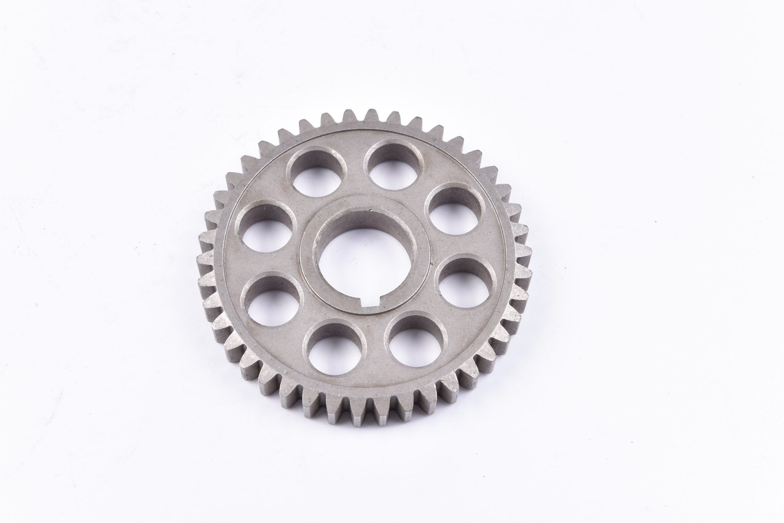 Sintered chain sprocket for spinning drive