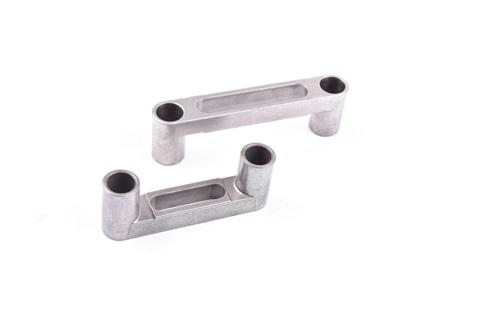Sintered spacer block for take-up mechanism